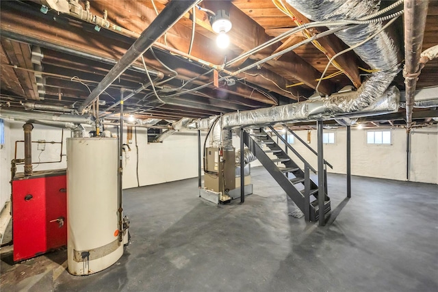 basement featuring gas water heater and heating unit