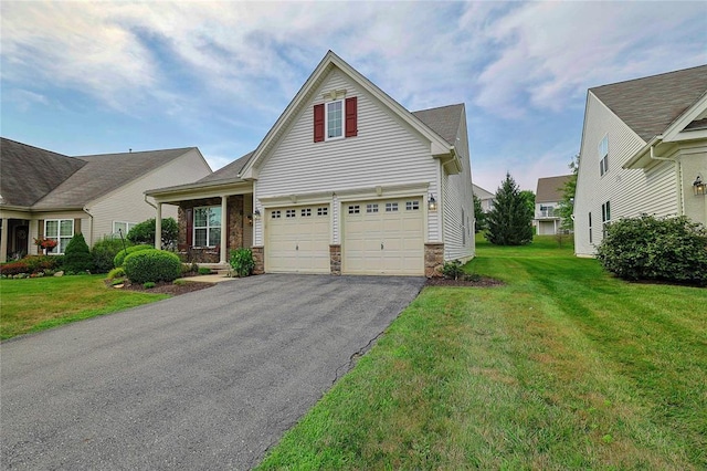 view of front of home featuring a front lawn and a garage