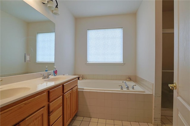 bathroom featuring tile patterned floors, vanity, and plus walk in shower