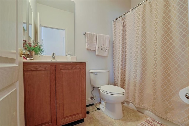 bathroom with tile patterned floors, vanity, and toilet