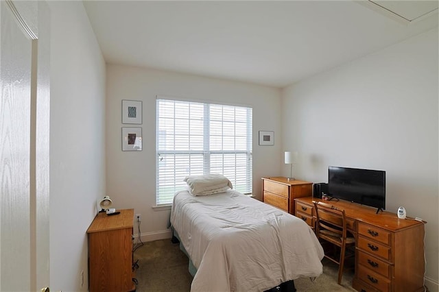 carpeted bedroom featuring multiple windows