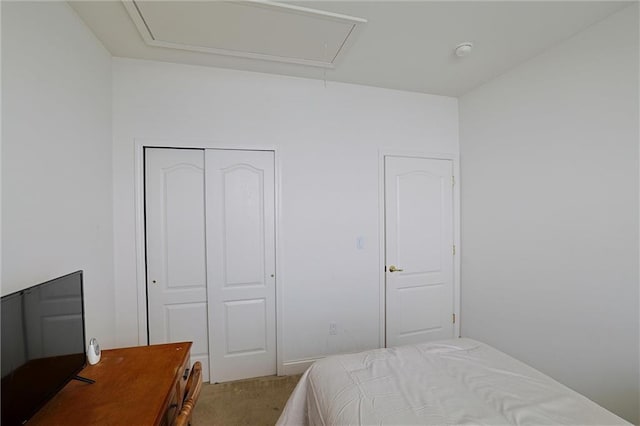 carpeted bedroom featuring a closet