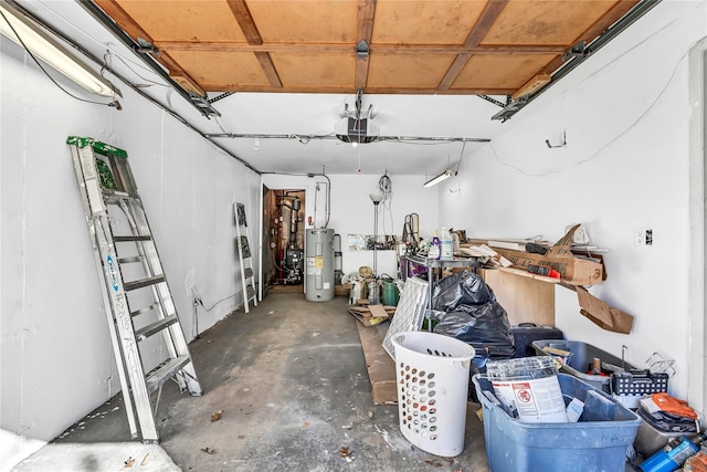 garage featuring water heater and a garage door opener