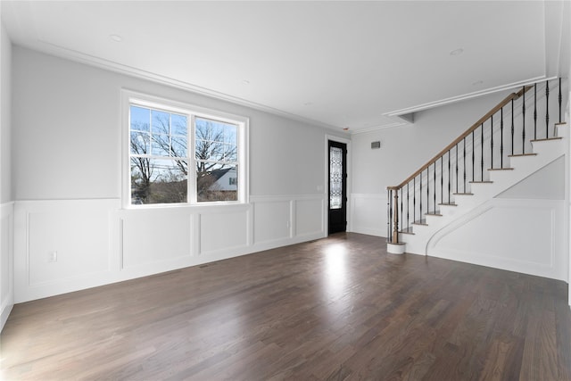 entryway featuring dark hardwood / wood-style flooring and ornamental molding