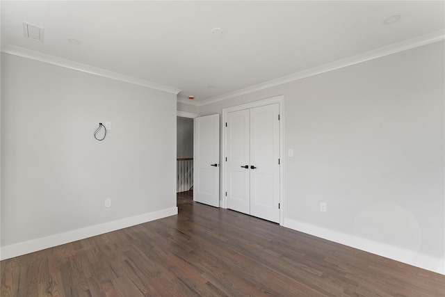 unfurnished room featuring crown molding and dark hardwood / wood-style floors