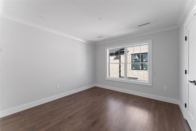 unfurnished room featuring dark hardwood / wood-style floors and ornamental molding