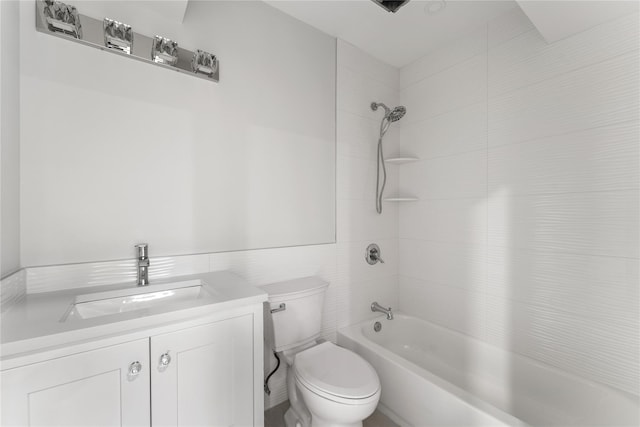 full bathroom with vanity, toilet, and tiled shower / bath