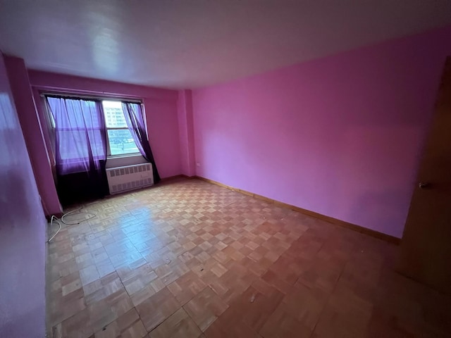 unfurnished room with light parquet floors