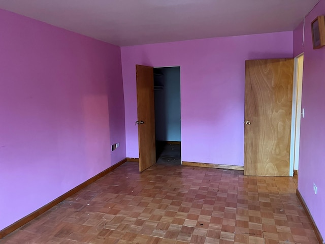 spare room with parquet flooring