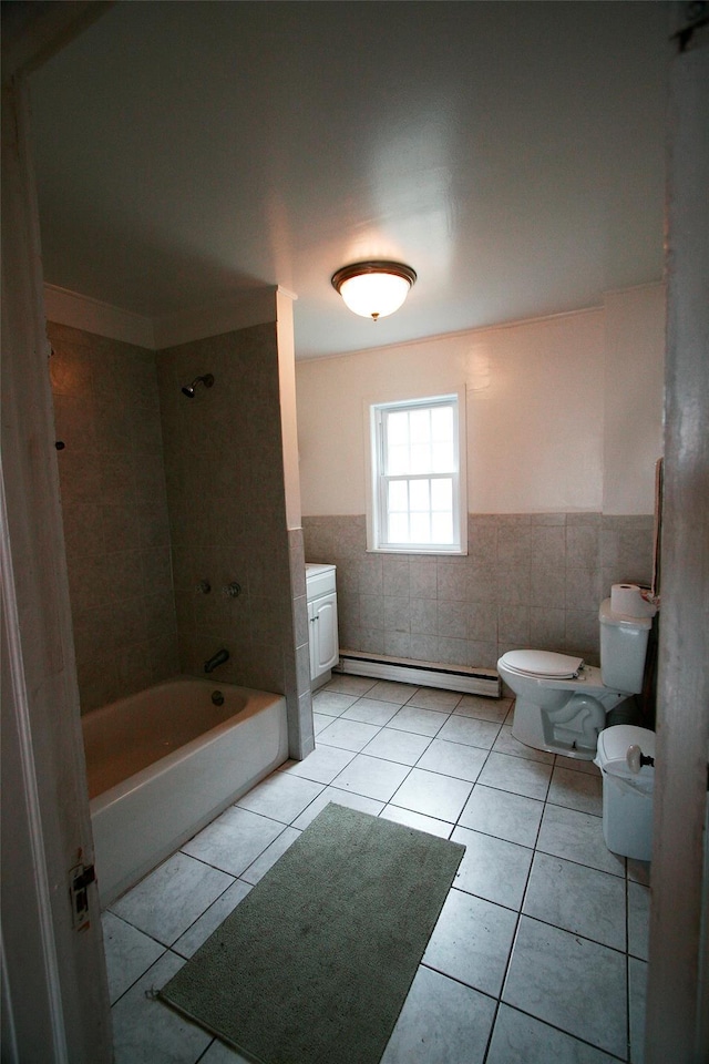 bathroom with tile patterned floors, tiled shower / bath combo, a baseboard radiator, tile walls, and toilet