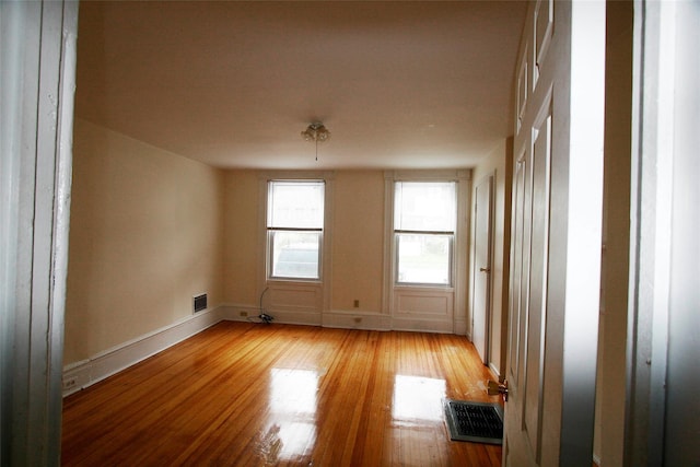 unfurnished room featuring light hardwood / wood-style flooring