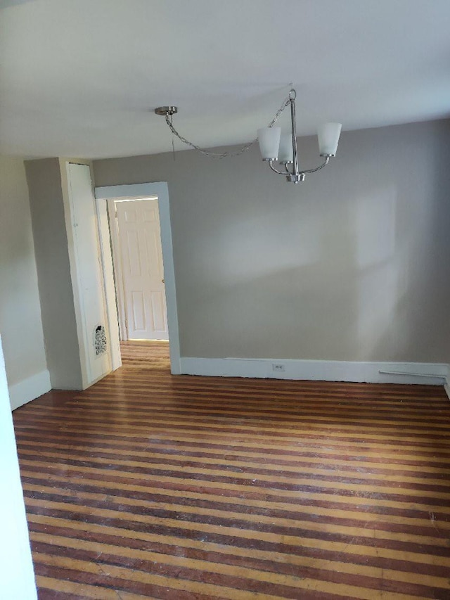 unfurnished dining area with an inviting chandelier