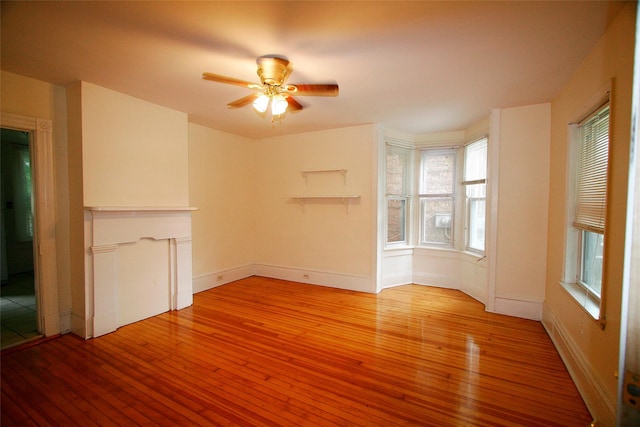 unfurnished living room featuring light wood-type flooring and ceiling fan