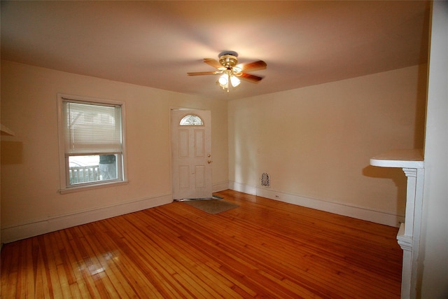 foyer entrance featuring wood-type flooring and ceiling fan