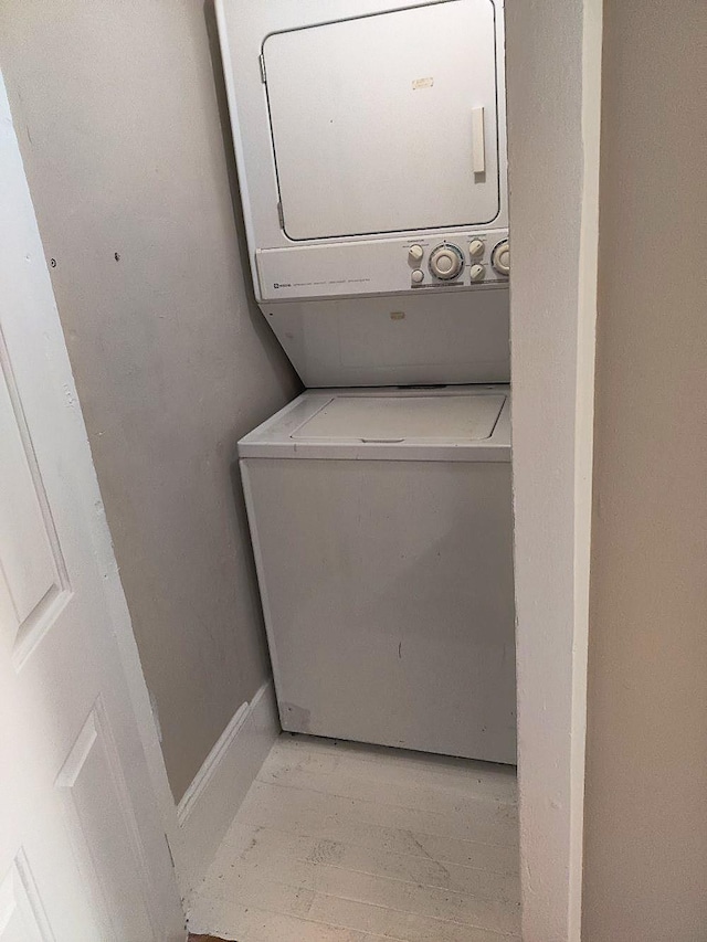 laundry room featuring stacked washer / dryer