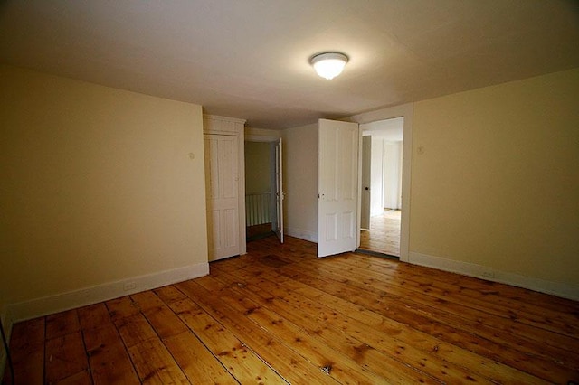 unfurnished bedroom featuring hardwood / wood-style floors