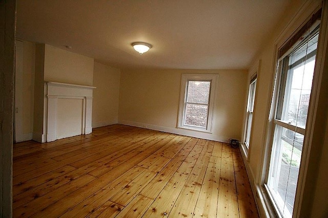 unfurnished room with light hardwood / wood-style floors