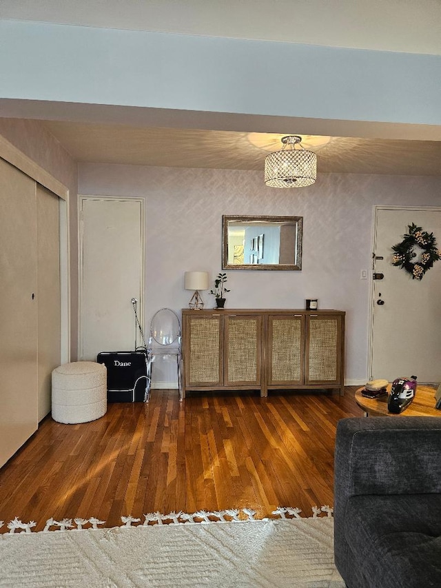 sitting room with dark wood-type flooring