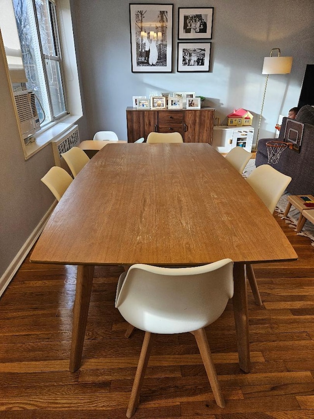 dining area featuring dark hardwood / wood-style floors and cooling unit