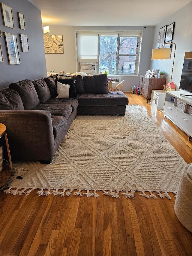 living room with hardwood / wood-style flooring and cooling unit