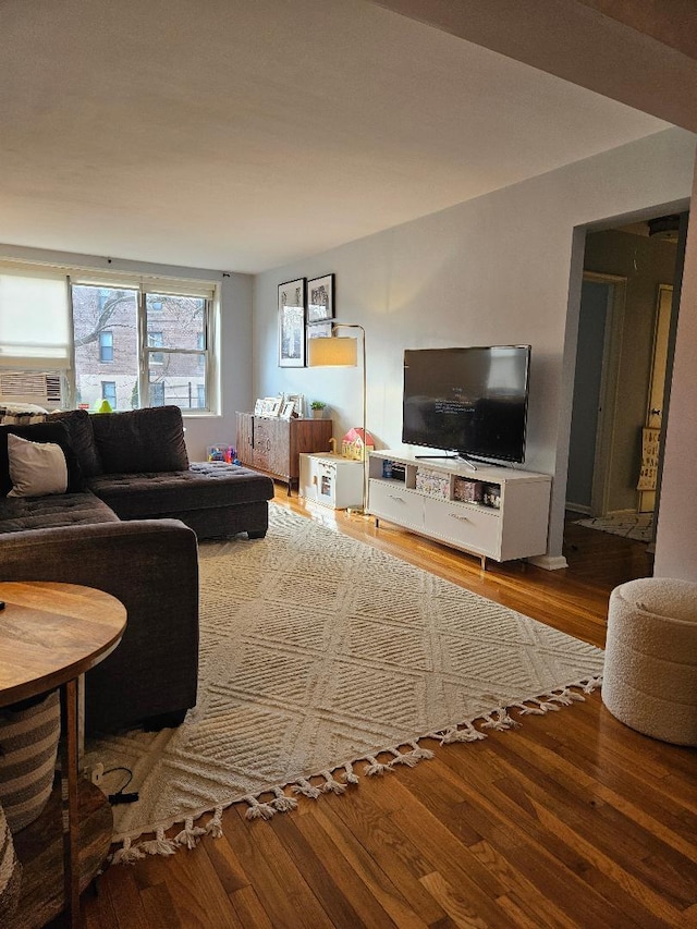 living room with hardwood / wood-style floors and cooling unit