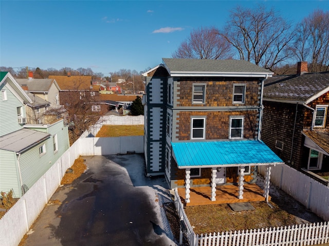 back of property featuring a porch