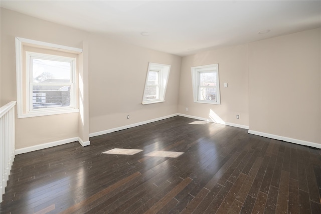 empty room with dark hardwood / wood-style floors