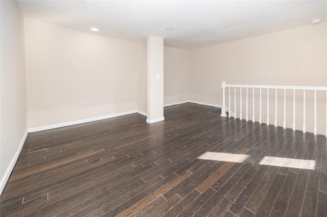 spare room featuring dark hardwood / wood-style flooring