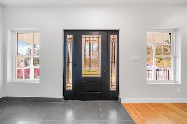 tiled foyer entrance featuring a healthy amount of sunlight