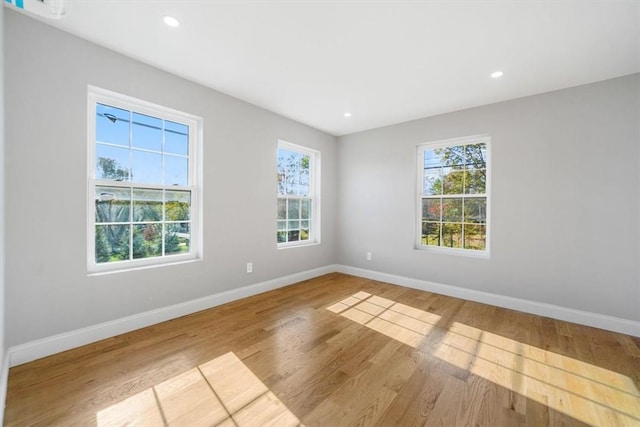 empty room with light hardwood / wood-style floors