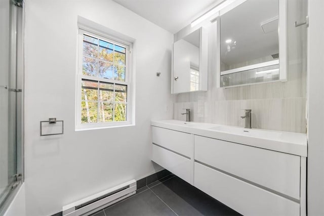 bathroom featuring vanity, tile patterned flooring, a shower with door, and a baseboard radiator