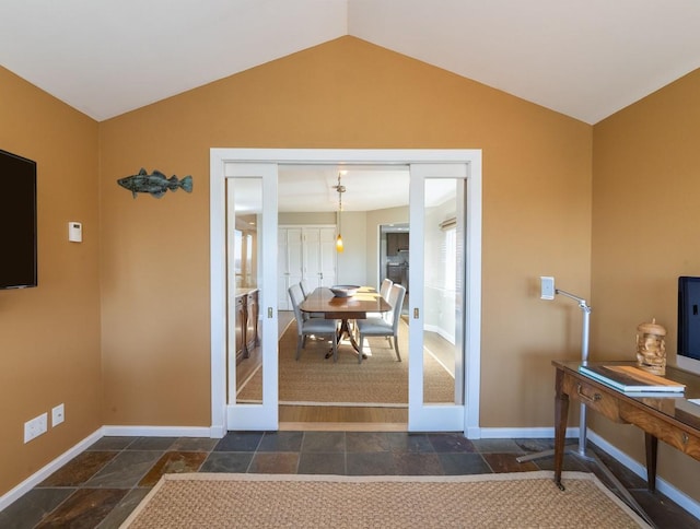 interior space with lofted ceiling and french doors