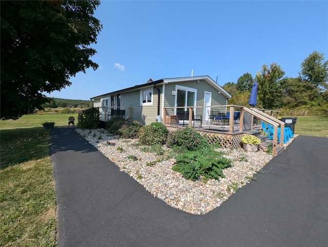 view of front of home featuring a wooden deck