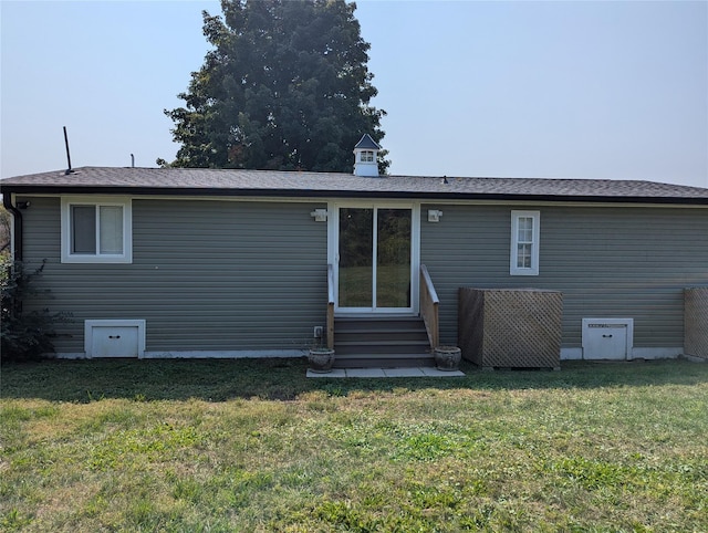 back of house with a yard