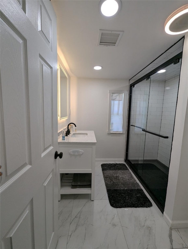 bathroom with vanity and an enclosed shower