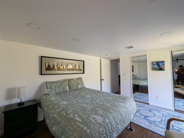 bedroom featuring dark hardwood / wood-style floors and a closet