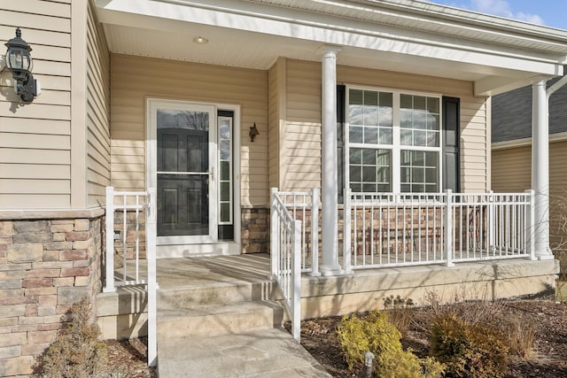 doorway to property featuring a porch