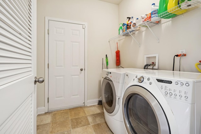 clothes washing area featuring independent washer and dryer