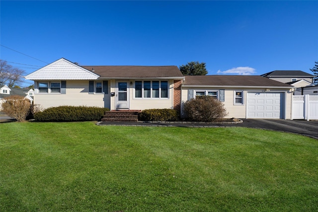 single story home with a garage and a front lawn