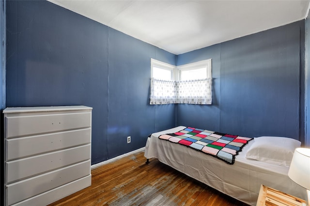 bedroom featuring dark wood-type flooring