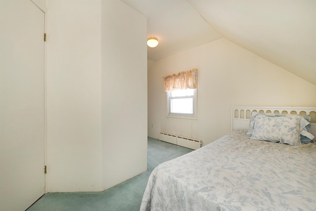 bedroom featuring vaulted ceiling, baseboard heating, and light colored carpet