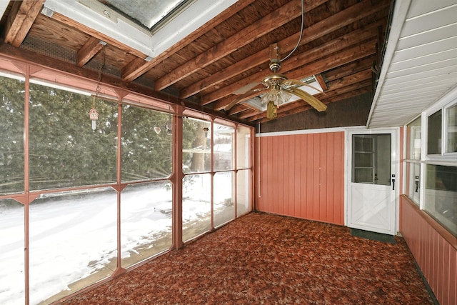 unfurnished sunroom featuring ceiling fan and lofted ceiling