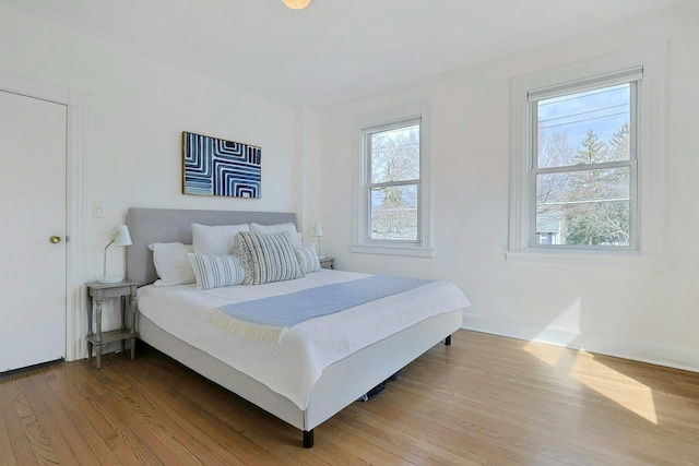 bedroom featuring wood finished floors