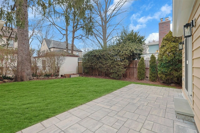 view of yard featuring a patio area and fence