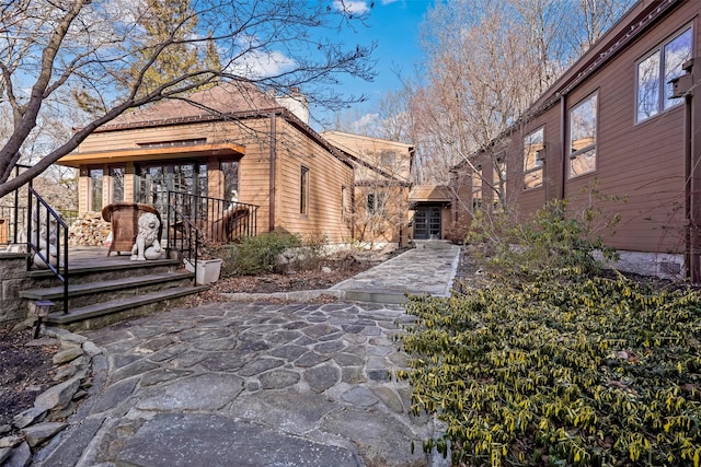 view of side of home featuring a patio area