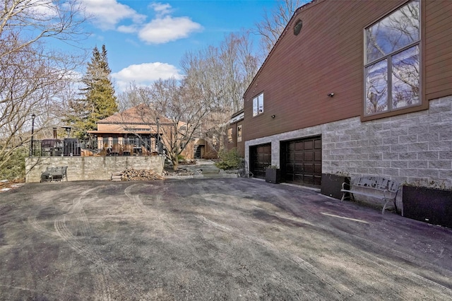 view of side of property with a garage