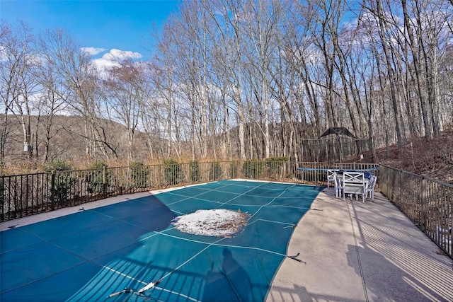 view of pool featuring a trampoline