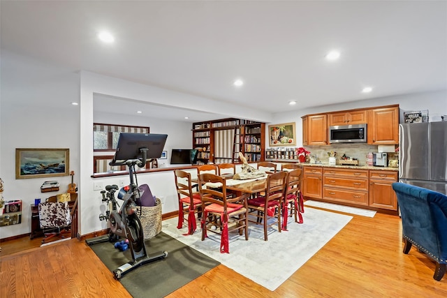 dining area with light hardwood / wood-style floors