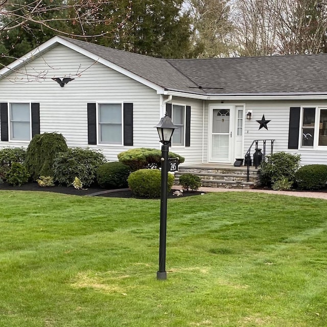 ranch-style house with a front yard