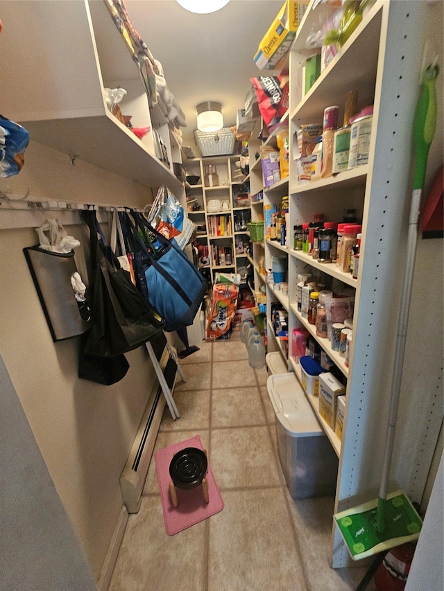 pantry with a baseboard heating unit